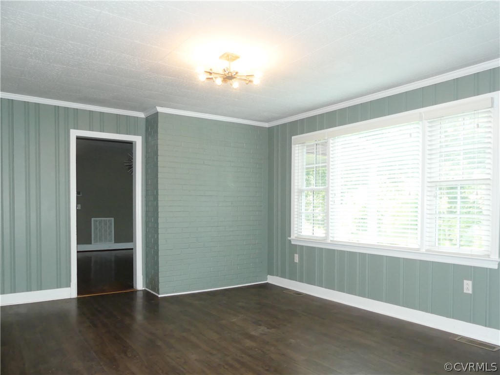 272 Germantown Road Keysville, VA 23947 - Photo 20 of 34 a view of an empty room with wooden floor and a window