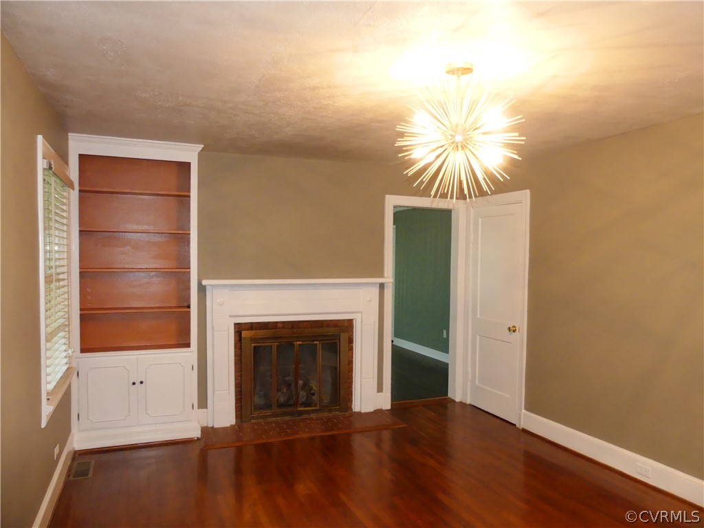 272 Germantown Road Keysville, VA 23947 - Photo 9 of 34 a view of empty room with wooden floor and fan