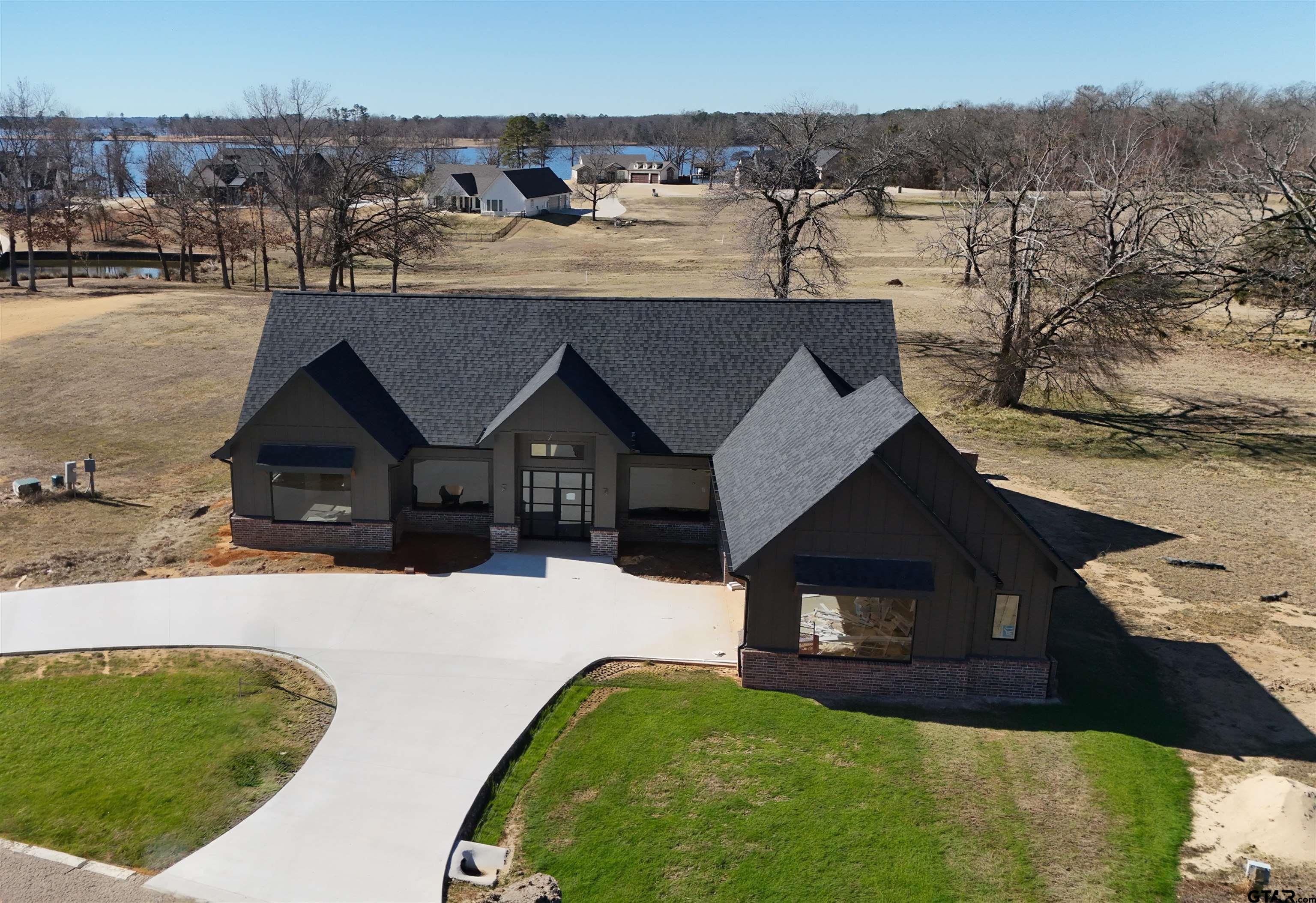 2713 Tbd Private Road Mount Pleasant, TX 75455 - Photo 1 of 15 a front view of a house with a yard