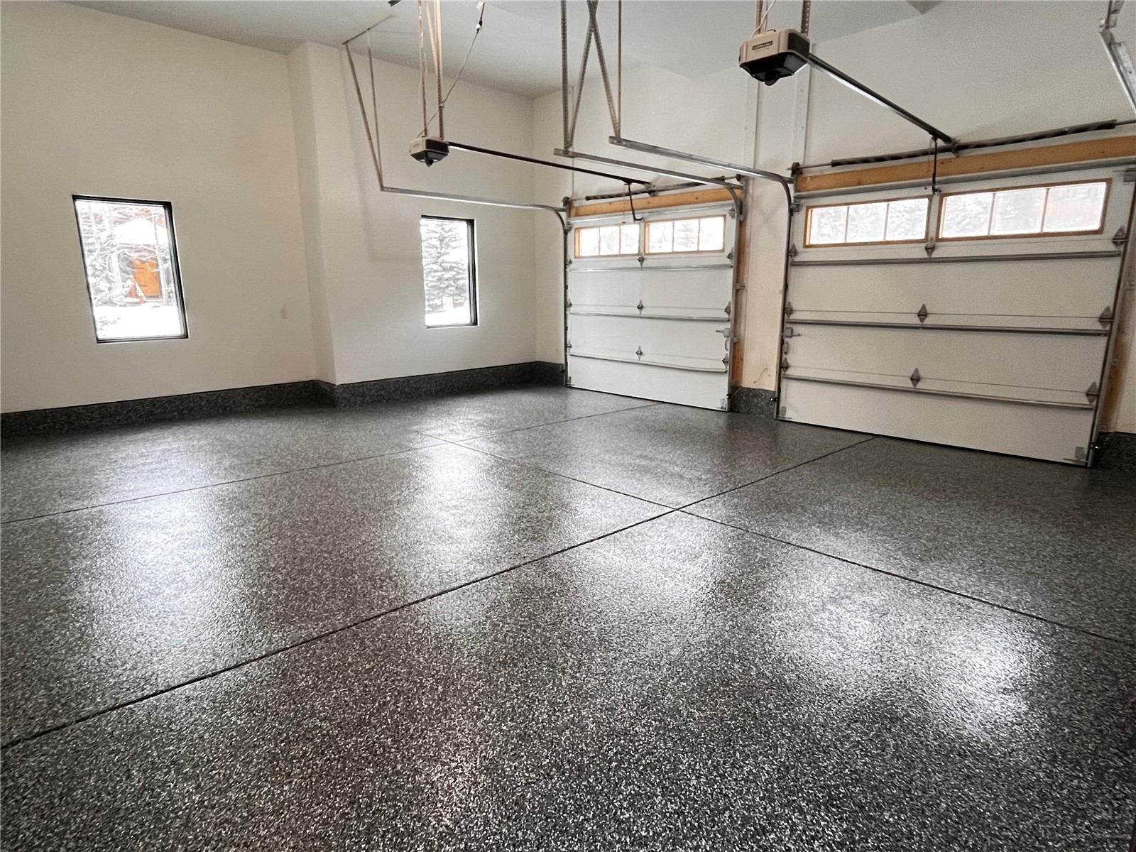16 Wolf Rock Road Keystone, CO 80435 - Photo 33 of 40 Oversized 2-car garage with ski storage, tall ceilings and epoxied floor.
