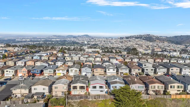 an aerial view of residential building with city view