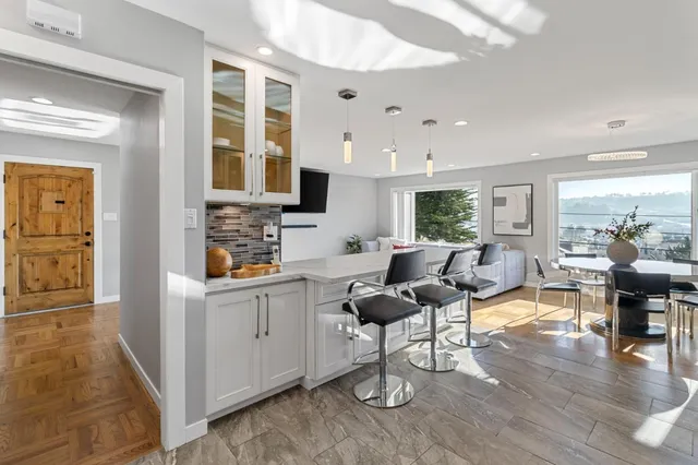 a living room with fireplace furniture and a wooden floor
