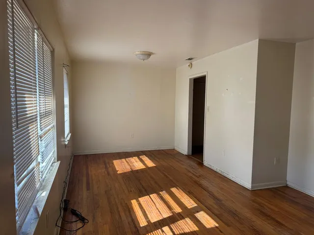 a view of an empty room and window