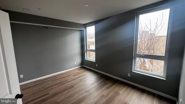 a view of entryway with wooden floor