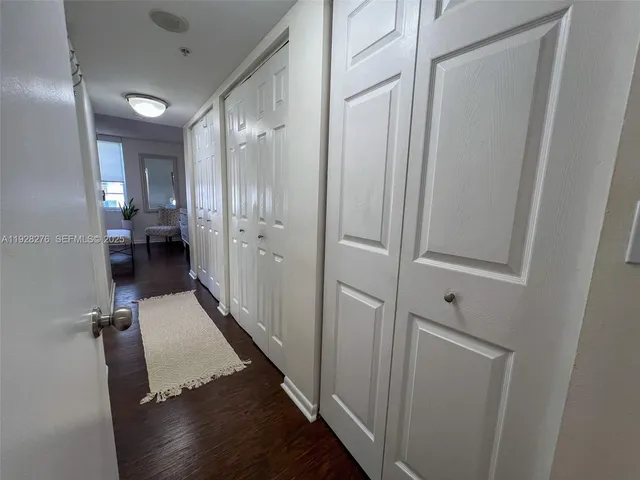 a view of a hallway with seating area