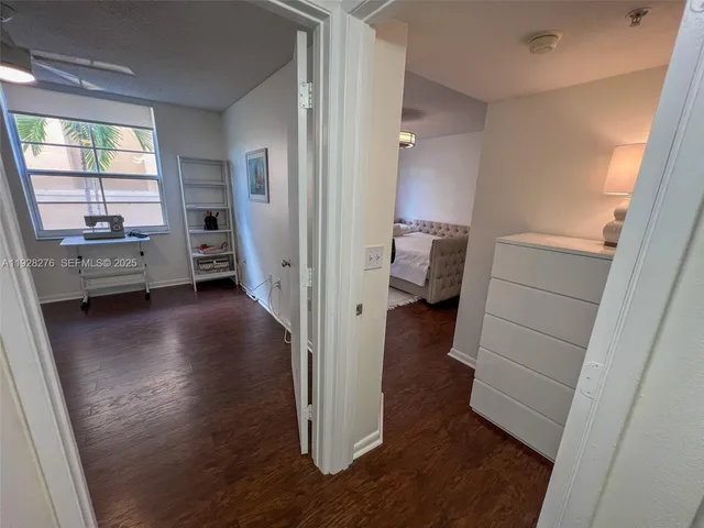 a view of entryway with livingroom and wooden floor