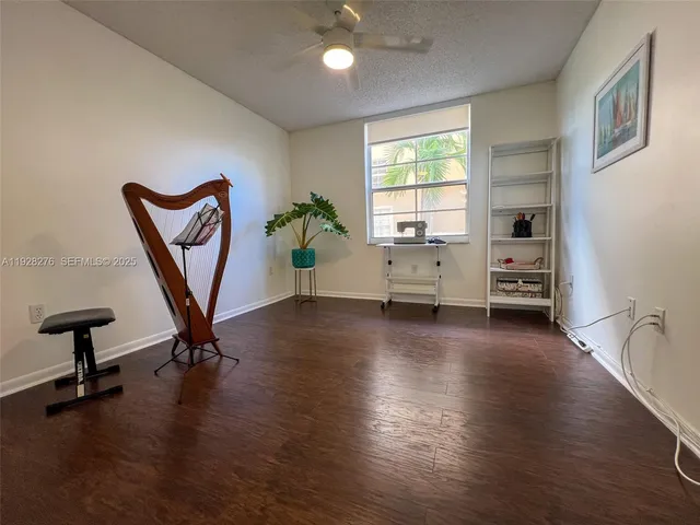 a view of a livingroom with furniture and a window