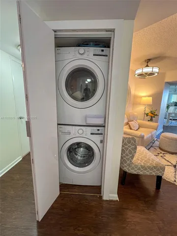 a view of a livingroom with furniture and washing machine
