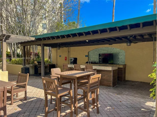 a patio with a table and chairs