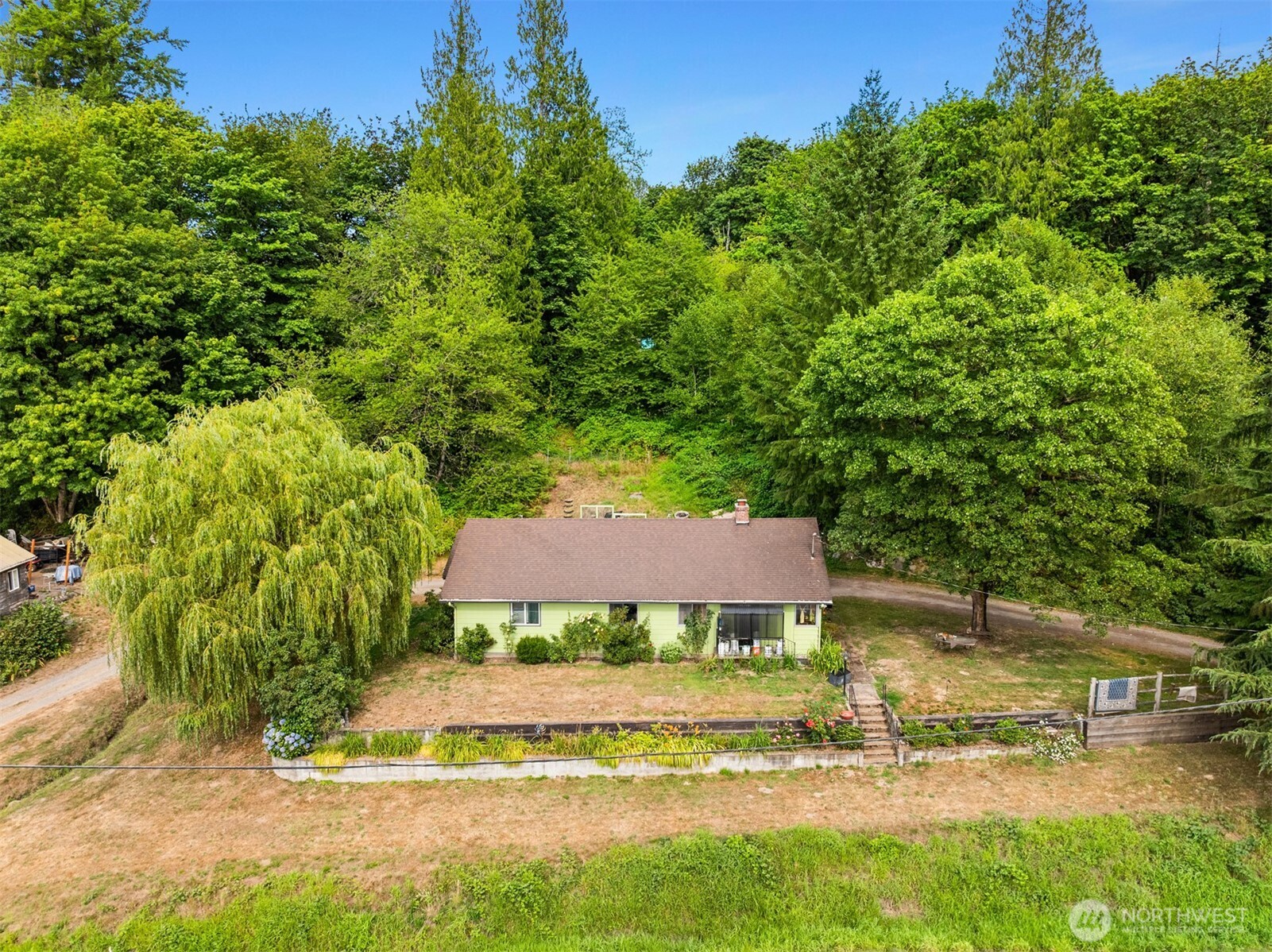 13-xxx Carnation-Duvall Road Northeast Duvall, WA 98019 - Photo 3 of 15 a view of a house with a yard