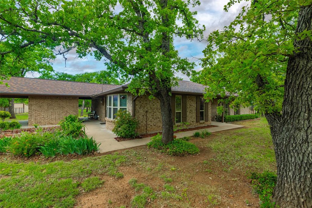970 Live Oak Road Santo, TX 76472 - Photo 2 of 40 front view of a house with a yard