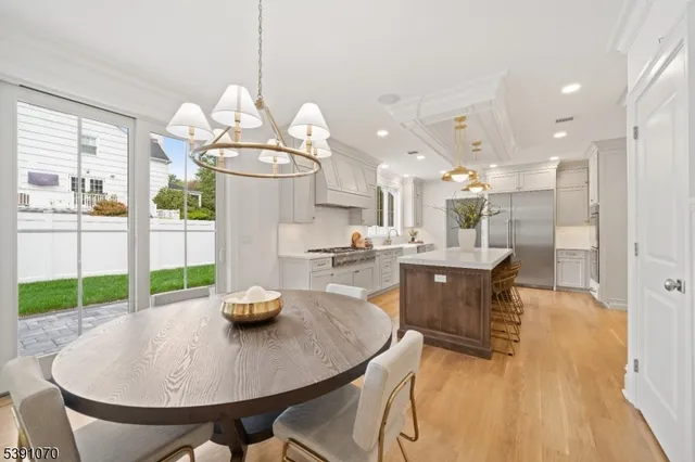 a kitchen with a table and chairs