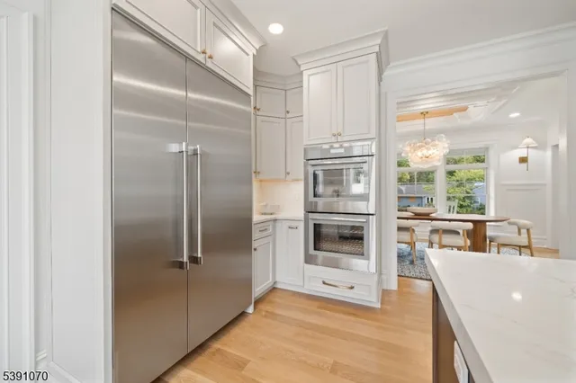 a kitchen with stainless steel appliances a refrigerator and a sink