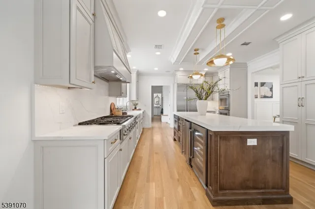 a kitchen with stainless steel appliances granite countertop lots of counter top space and cabinets