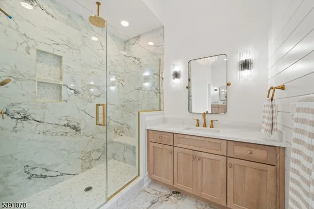 a bathroom with a shower sink and mirror