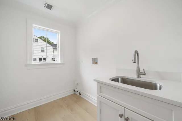 a close view of a sink and a window