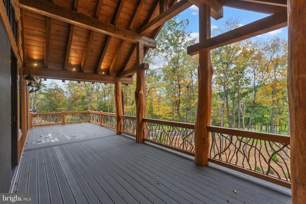 a view of porch with wooden floor