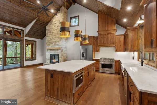 a kitchen that has a stove and a table