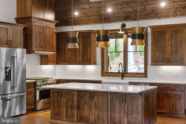 a kitchen with a refrigerator and a sink