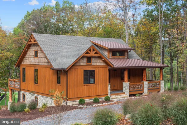 a front view of a house with yard