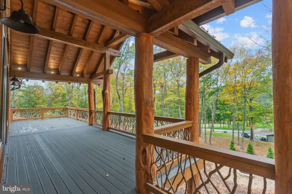 a view of porch with wooden floor in front of a house