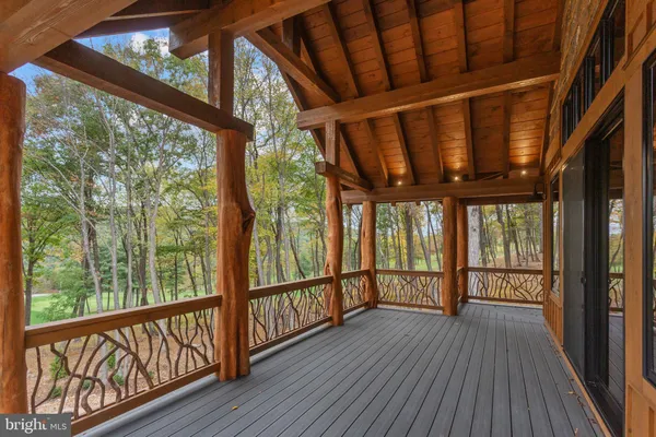 a view of a porch with wooden floor