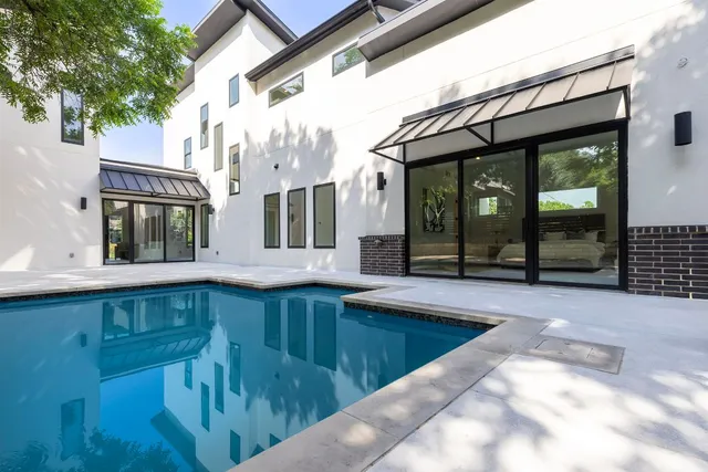 a view of a house with a swimming pool