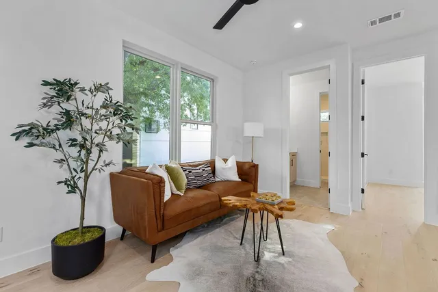 a bathroom with a sink double vanity granite tub shower and a mirror