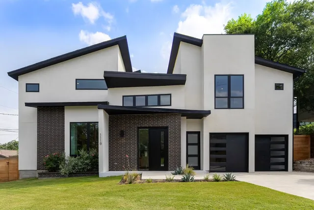 a view of a white house with a large windows