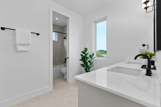 a bathroom with a sink a vanity and a mirror