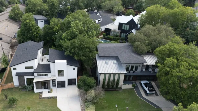 a view of a house with a yard and sitting area