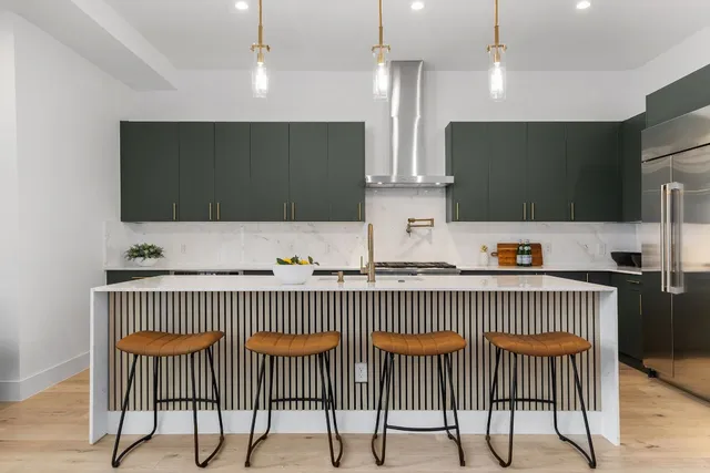 a bedroom with a large bed and a large window