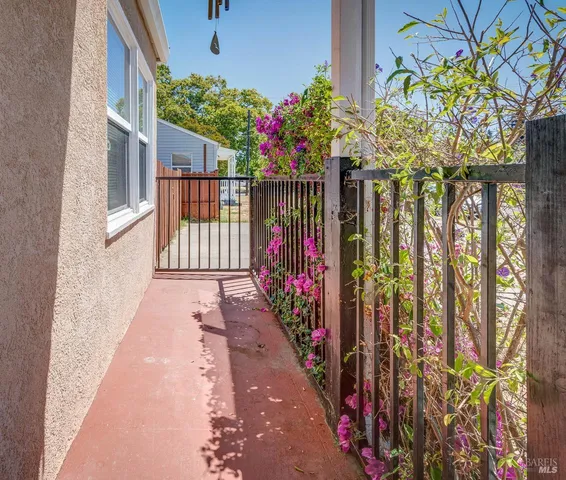 a view of a house with flower garden
