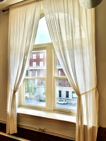 a view of an empty room and window
