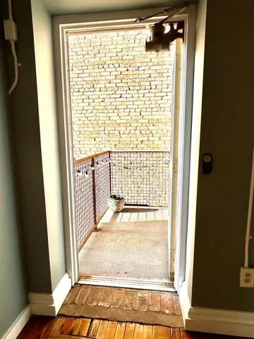 a view of a wooden door with a window