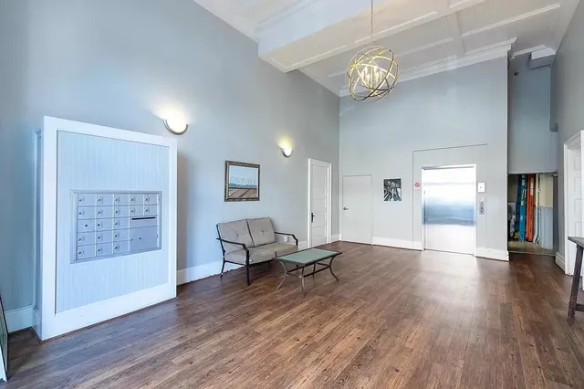 a view of a room with wooden floor