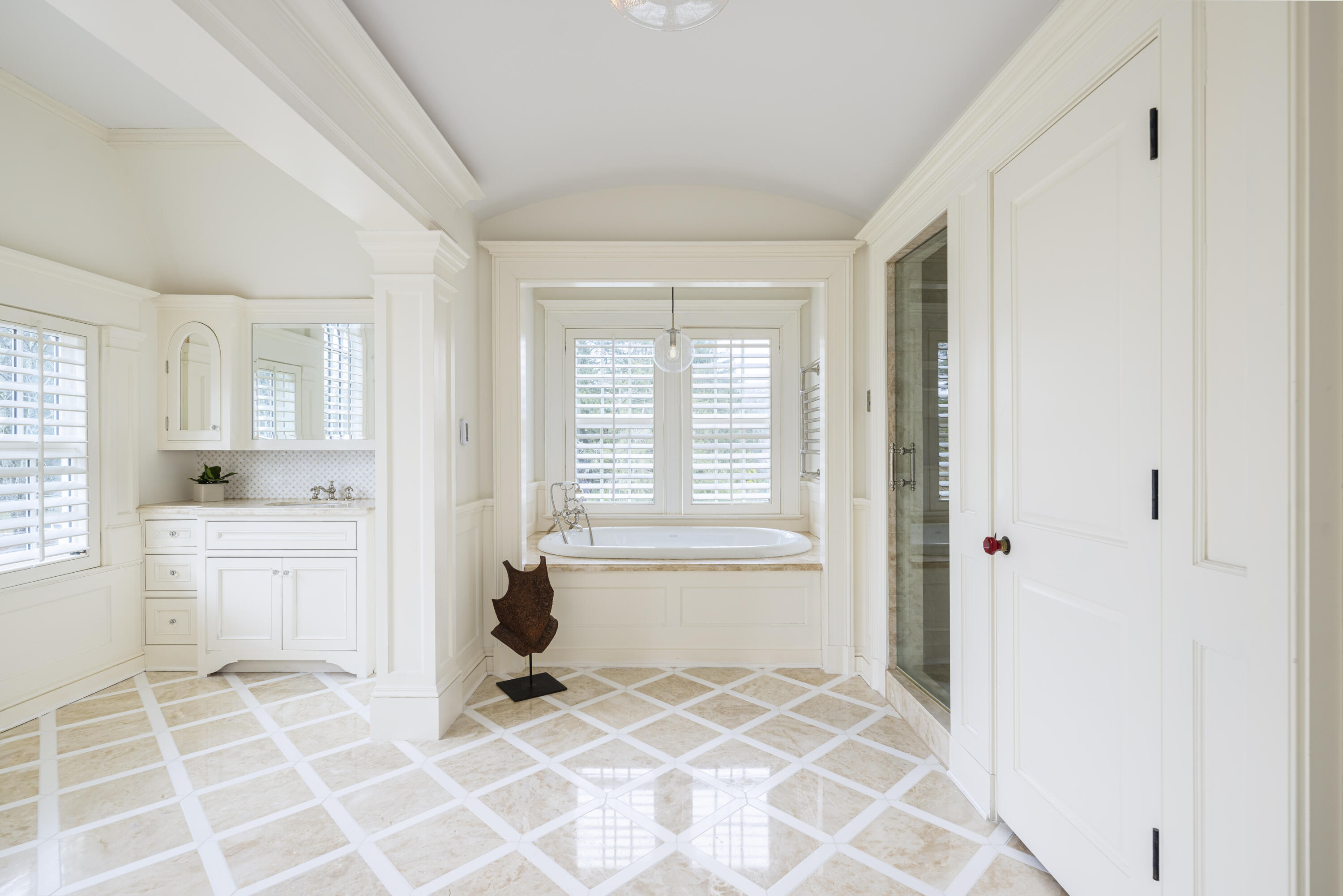 727 Smith Ridge Road New Canaan, CT 06840 - Photo 17 of 31 a spacious bathroom with a granite countertop sink a mirror and a bathtub
