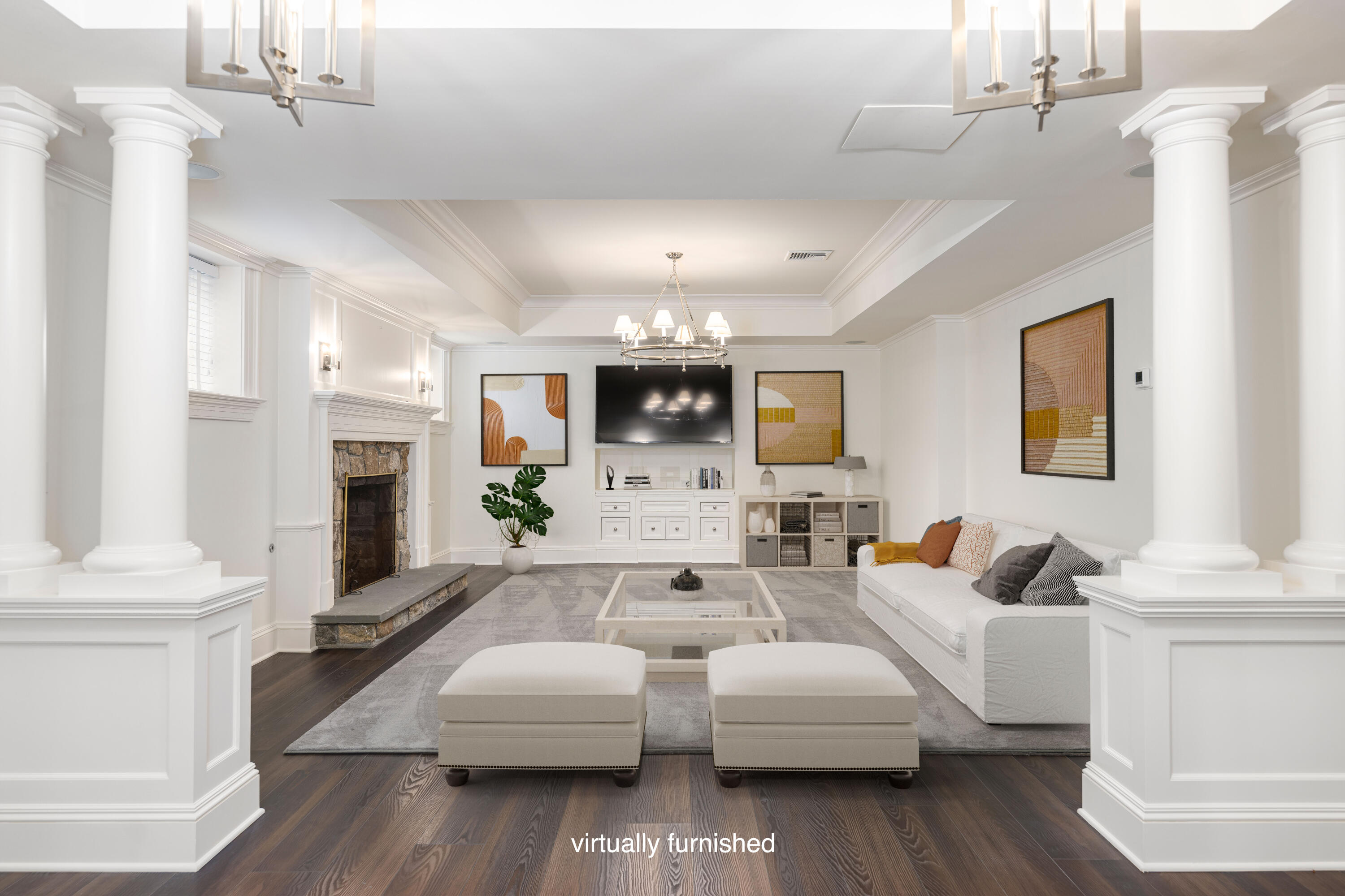 727 Smith Ridge Road New Canaan, CT 06840 - Photo 30 of 31 a living room with couches a fireplace and kitchen view with wooden floor