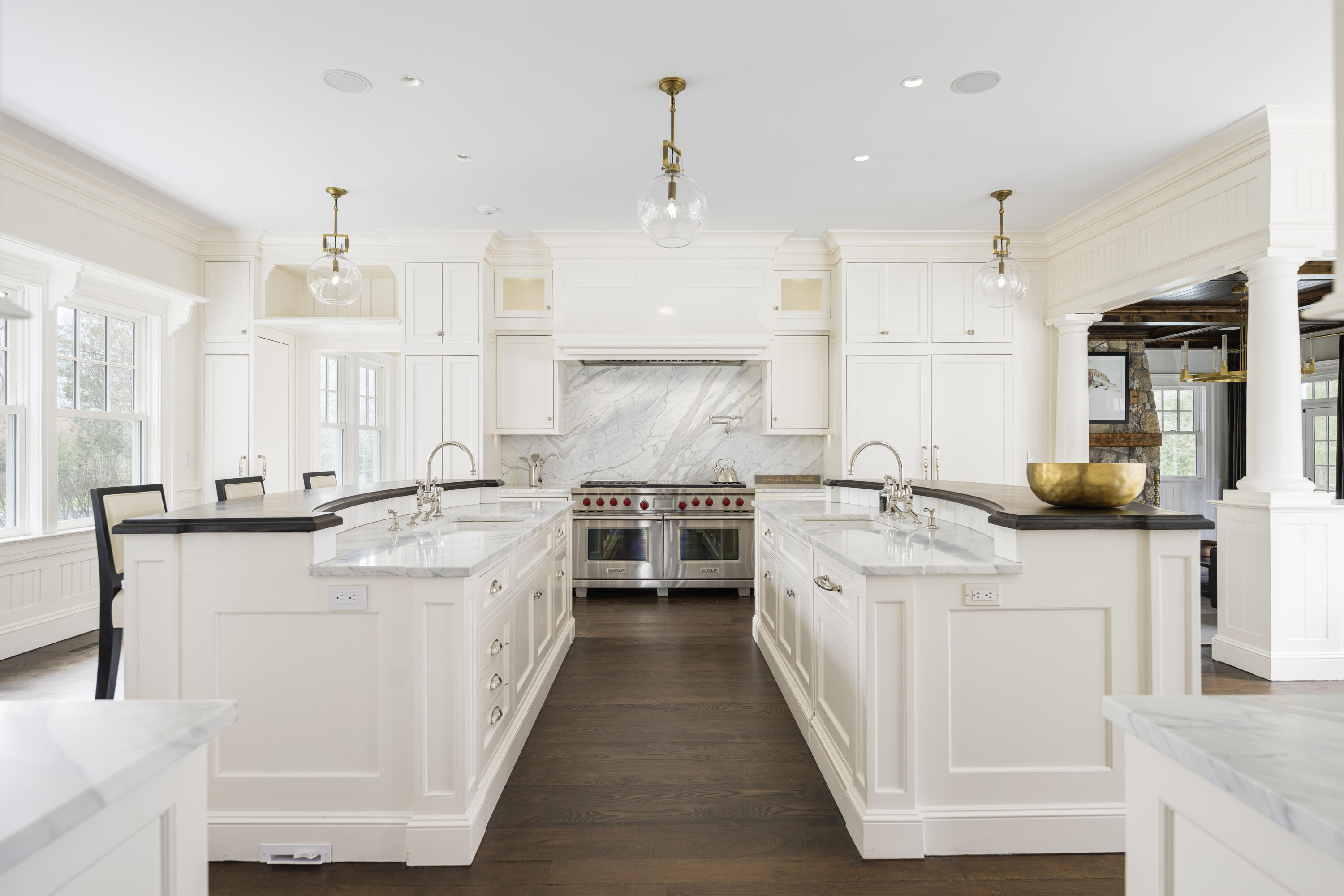 727 Smith Ridge Road New Canaan, CT 06840 - Photo 10 of 31 a large white kitchen with stainless steel appliances