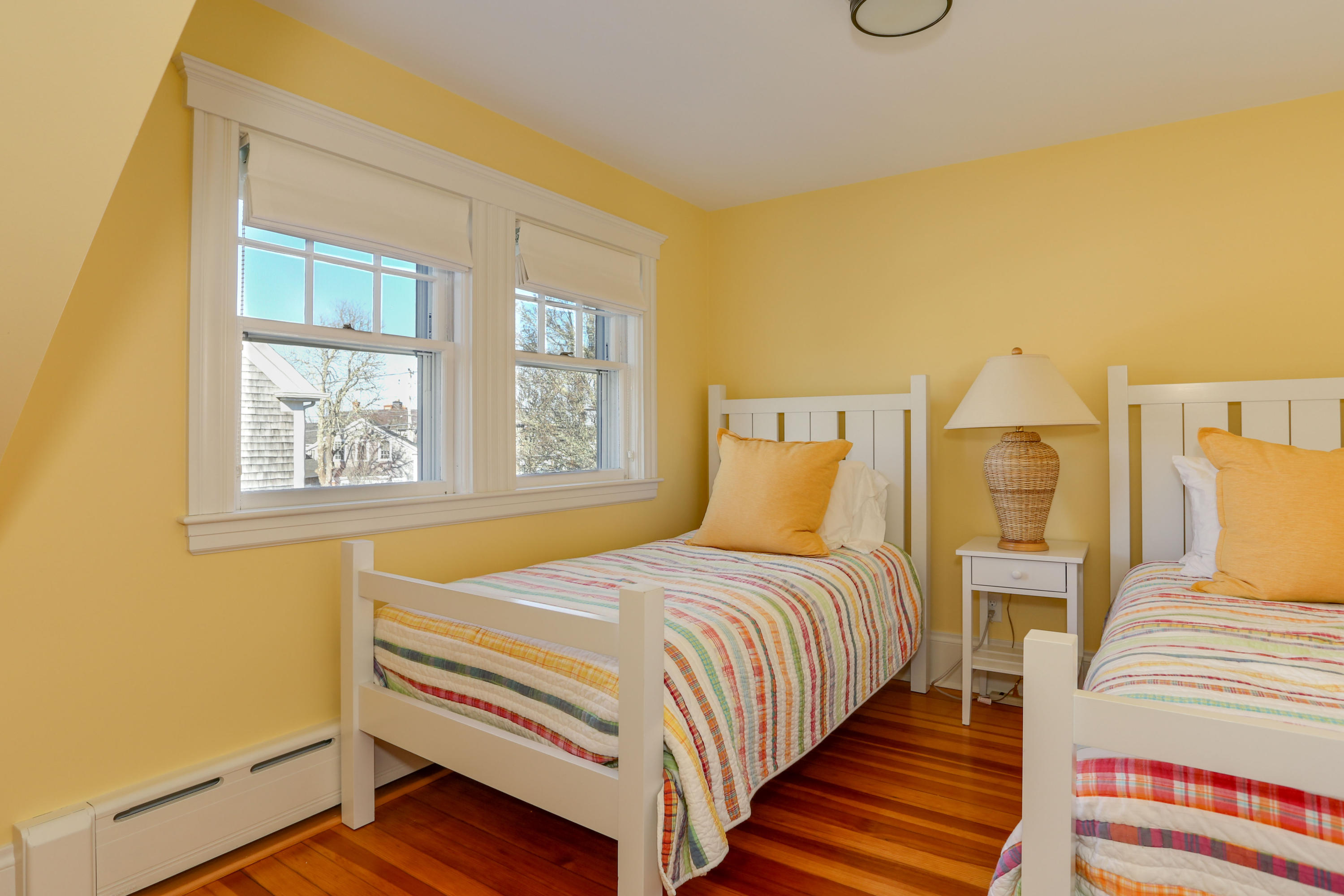 22 Mill Pond Road Chatham, MA 02633 - Photo 16 of 35 a bedroom with a bed and wooden floor