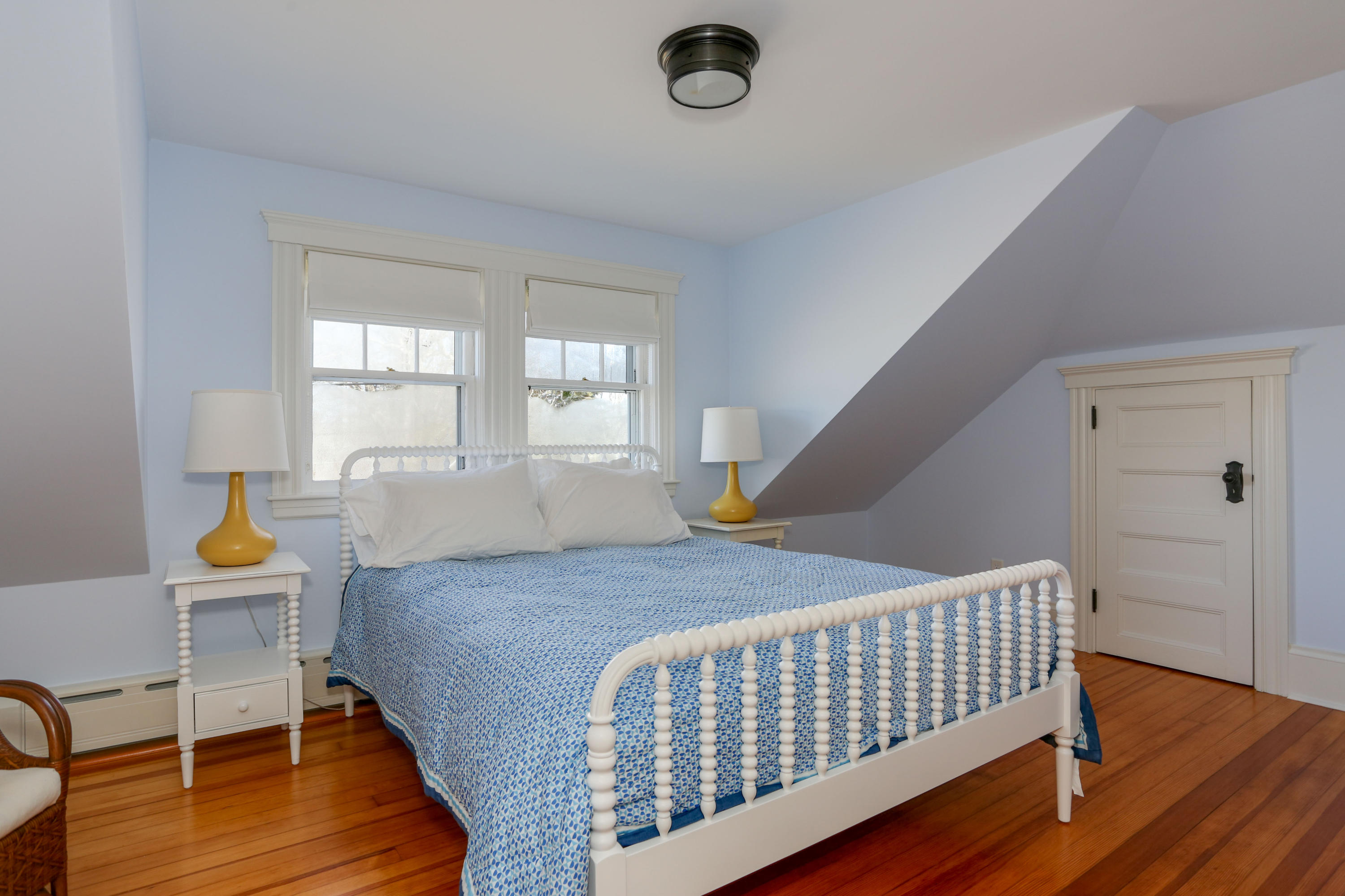 22 Mill Pond Road Chatham, MA 02633 - Photo 17 of 35 a bedroom with a bed and wooden floor