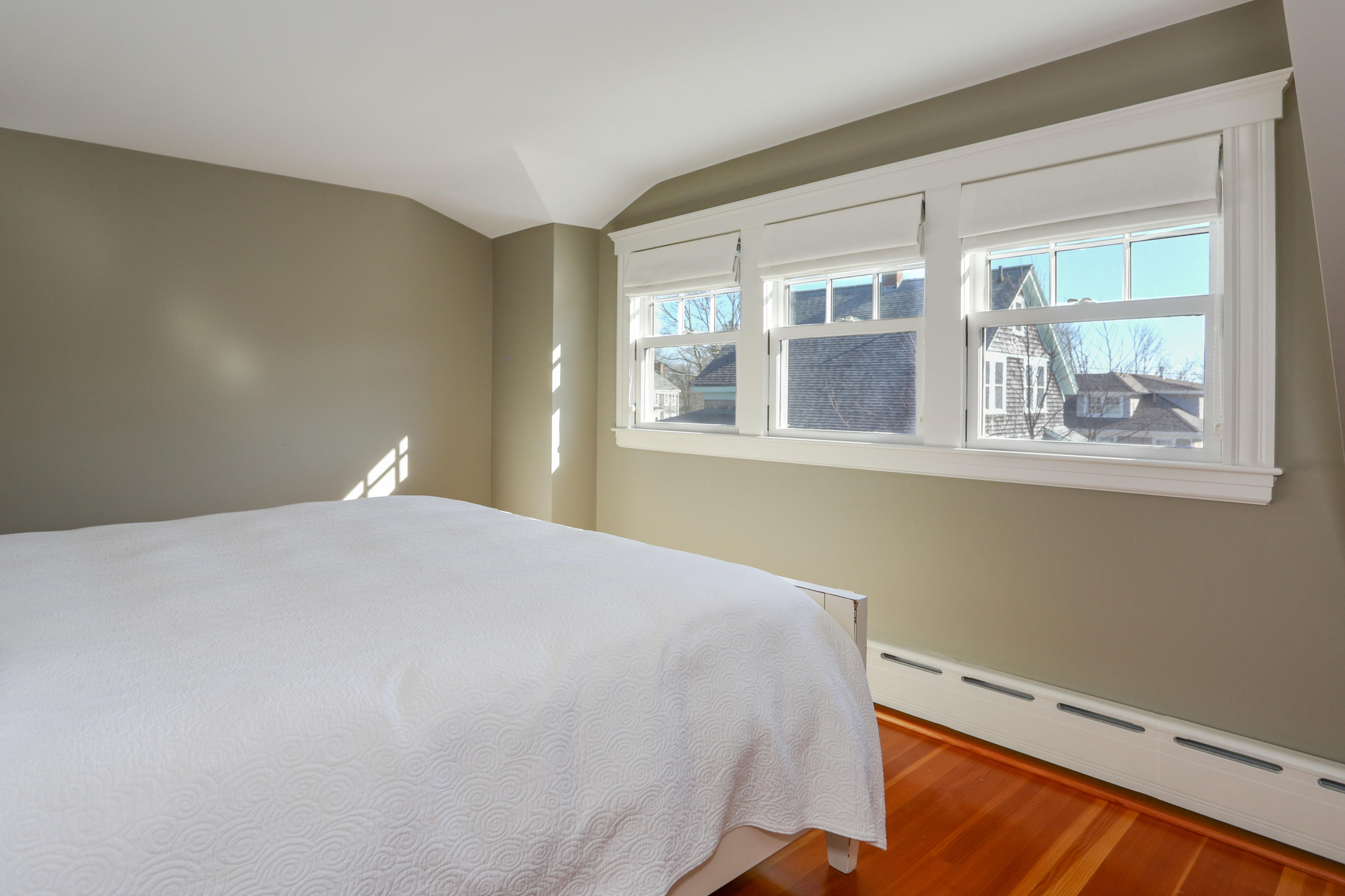 22 Mill Pond Road Chatham, MA 02633 - Photo 23 of 35 a bedroom with a bed and wooden floor