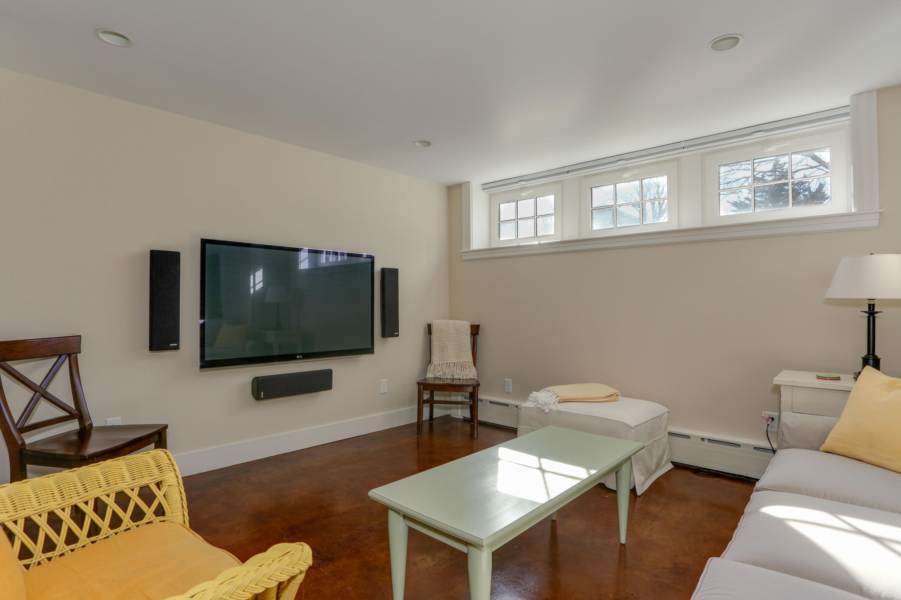 22 Mill Pond Road Chatham, MA 02633 - Photo 26 of 35 a living room with furniture a flat screen tv and a window