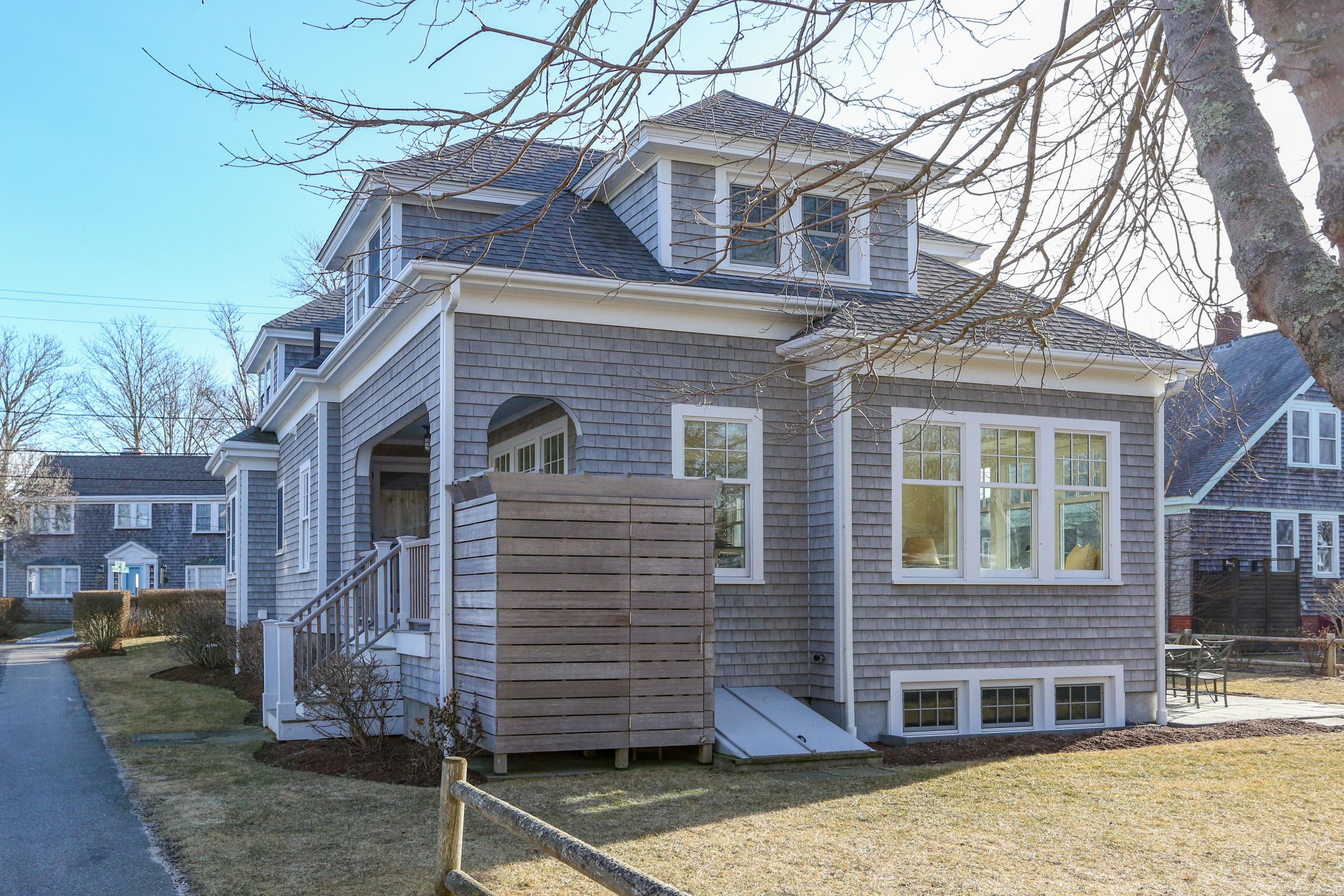 22 Mill Pond Road Chatham, MA 02633 - Photo 30 of 35 a front view of a house with garden