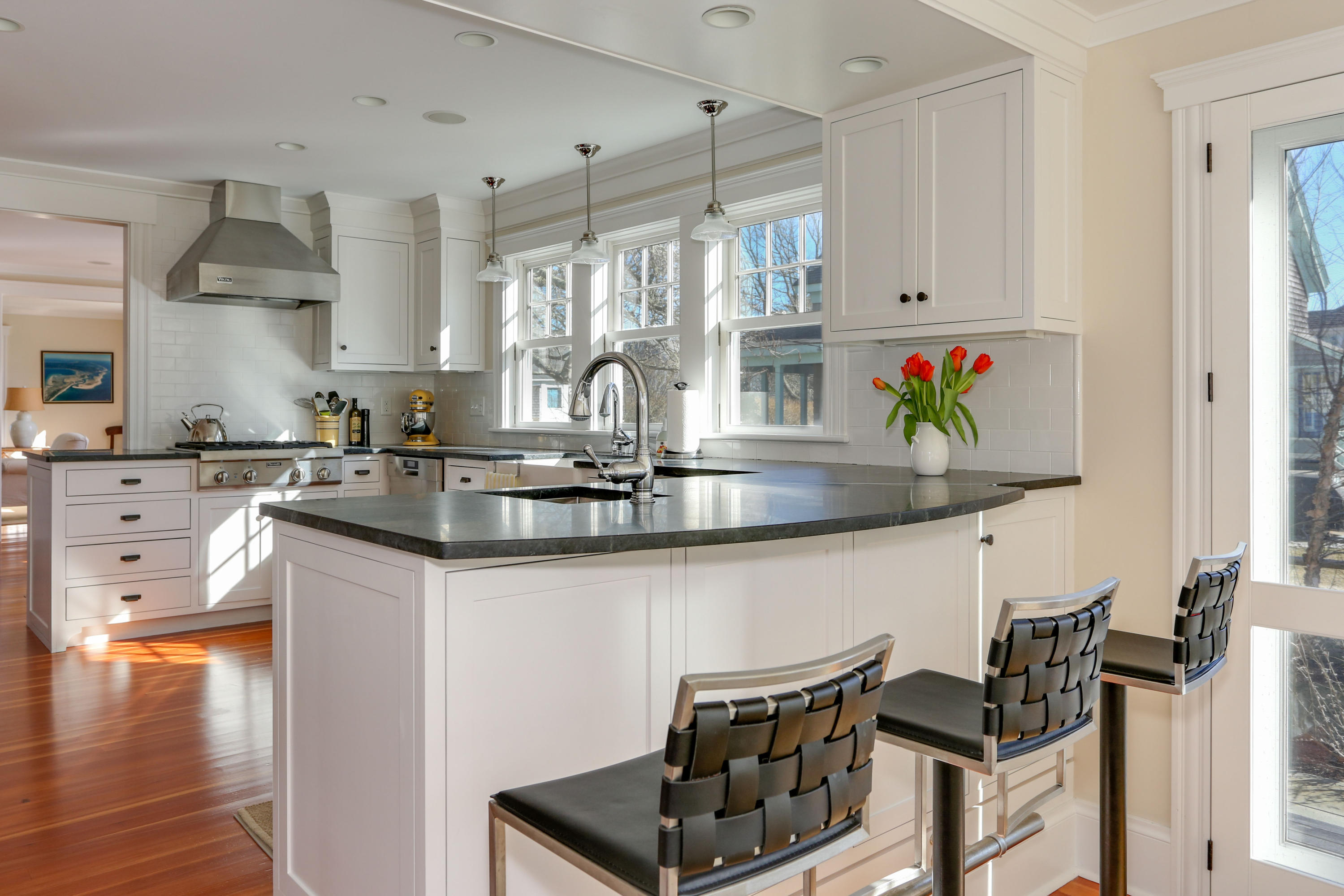 22 Mill Pond Road Chatham, MA 02633 - Photo 6 of 35 a kitchen with stainless steel appliances granite countertop a sink stove and cabinets