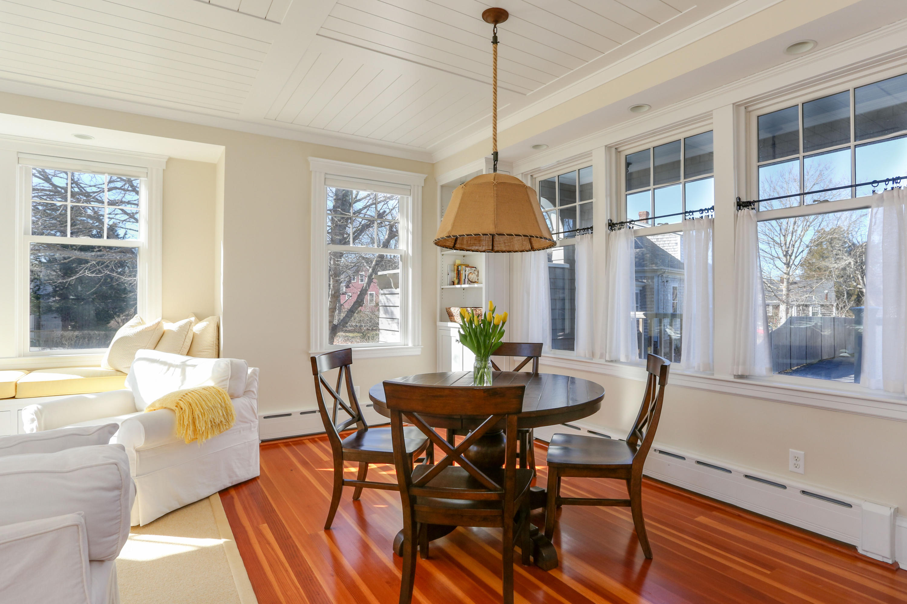 22 Mill Pond Road Chatham, MA 02633 - Photo 8 of 35 a dining room with furniture a chandelier and wooden floor