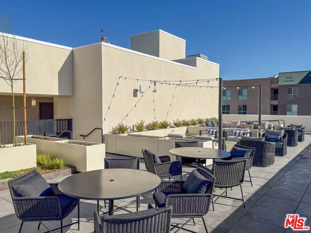 a view of outdoor kitchen with outdoor seating