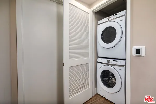 a view of a hallway with washer and dryer