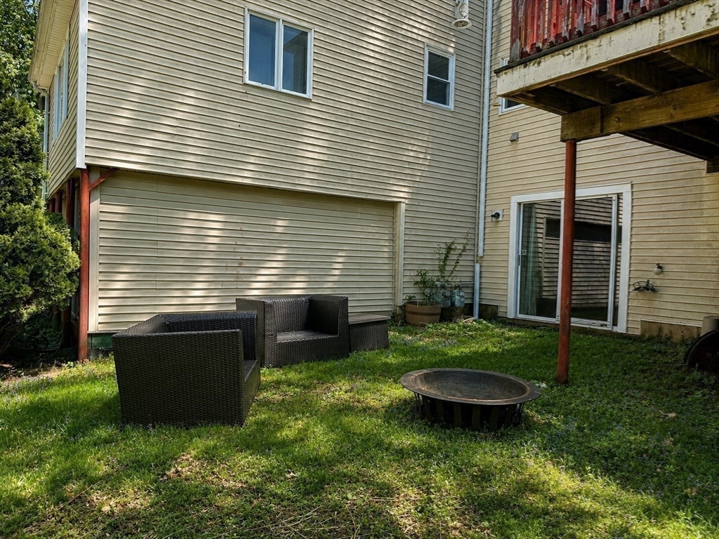 38 Crescent Road, Unit 38 Needham, MA 02494 - Photo 23 of 23 a view of a backyard with plants and large tree