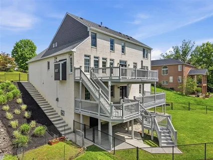 a front view of a house with a deck